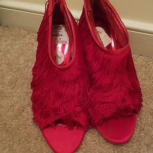 Red fringed open toe heels